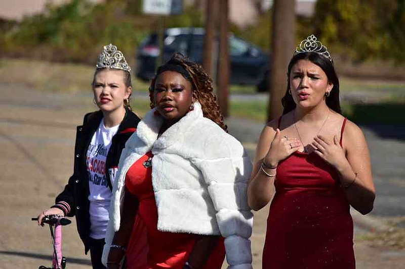Grand Rising Queen Kylie Rodenberg and sweethearts Makenzie Johnson and Alih Canales represent Stacy Hardin's Pine Bluff Dance Academy at the Pine Bluff Regional Veterans Parade on Saturday, Nov. 15, 2025. (Pine Bluff Commercial/I.C. Murrell)