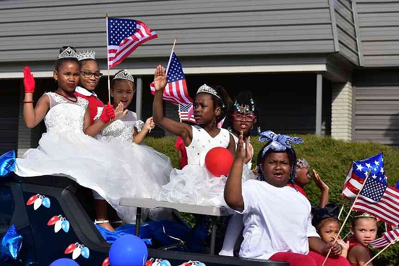 Members of Stacy Hardin's Pine Bluff Dance Academy serve on a royal court during the Pine Bluff Regional Veterans Parade on Saturday, Nov. 15, 2025. (Pine Bluff Commercial/I.C. Murrell)