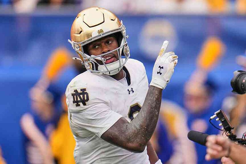 Notre Dame wide receiver Malachi Fields (0) celebrates after scoring on a pass from quarterback CJ Carr during the first half of an NCAA college football game against Pittsburgh, Saturday, Nov. 15, 2025, in Pittsburgh. (AP Photo/Gene J. Puskar)
