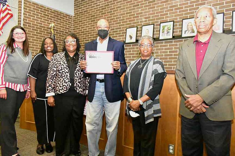 Members of New St. Hurricane Missionary Baptist Church are honored for donations from its outreach pantry. (Pine Bluff Commercial/I.C. Murrell)
