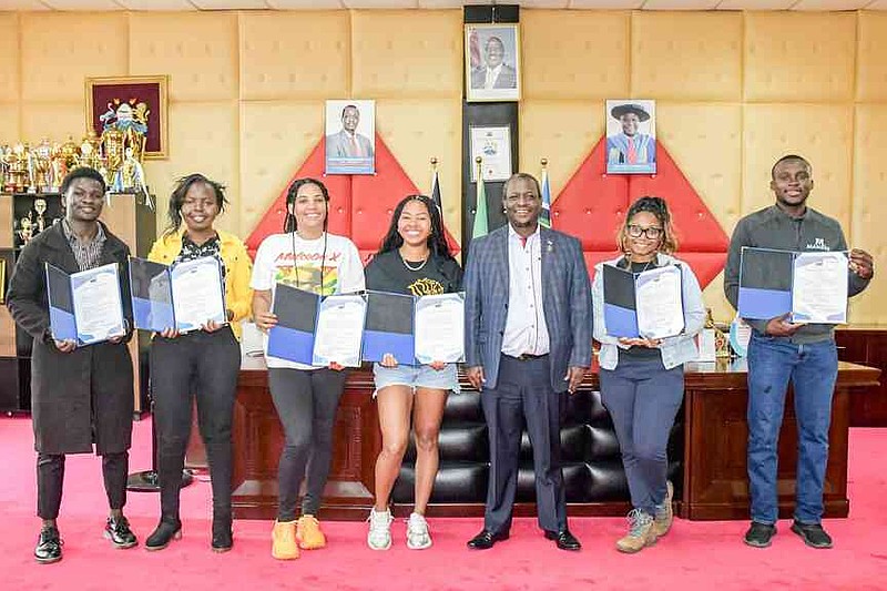 Student fellows from Chuka University, the University of Arkansas at Pine Bluff and Southern University in Louisiana are awarded certificates by Chuka University Vice Chancellor Henry Mutembei. (Special to The Commercial/University of Arkansas at Pine Bluff)