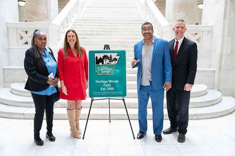 In 2024, Eugene Sinclair's family land was recognized through the Arkansas Century Farm Program. The presentation included Annette Barrett Sinclair, left, Gov. Sarah Huckabee Sanders, Eugene Sinclair, and Wes Ward, Arkansas Secretary of Agriculture. (Special to The Commercial/Office of Governor Sarah Huckabee Sanders)