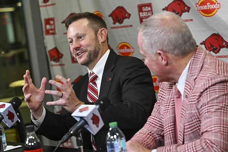 Arkansas's new head football coach Ryan Silverfield, left, and athletic director Hunter Yurachek speak to reporters during an NCAA college football press conference, Thursday, Dec. 4, 2025, in Fayetteville, Ark. (Hank Layton/The Northwest Arkansas Democrat-Gazette via AP)