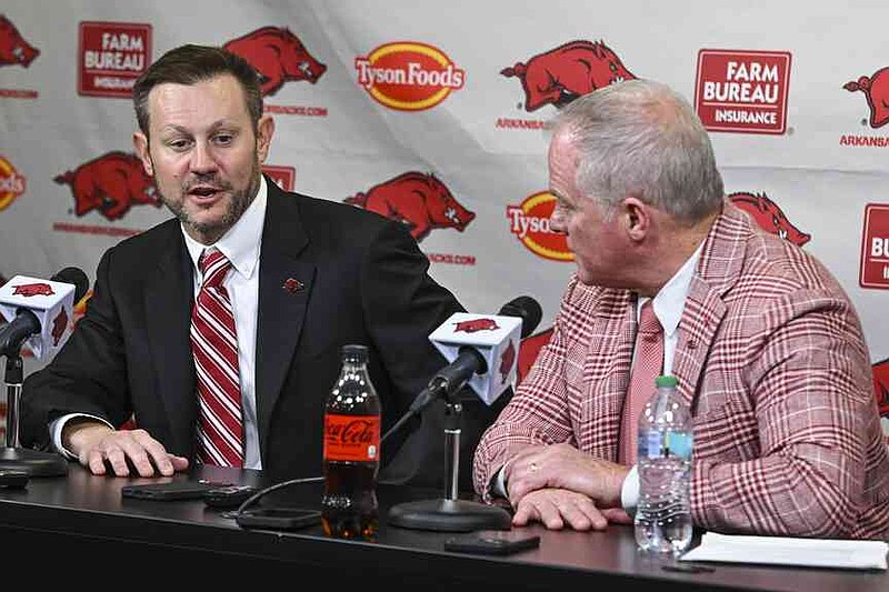 Arkansas's new head football coach Ryan Silverfield, left, and athletic director Hunter Yurachek speak to reporters during an NCAA college football press conference, Thursday, Dec. 4, 2025, in Fayetteville, Ark. (Hank Layton/The Northwest Arkansas Democrat-Gazette via AP)