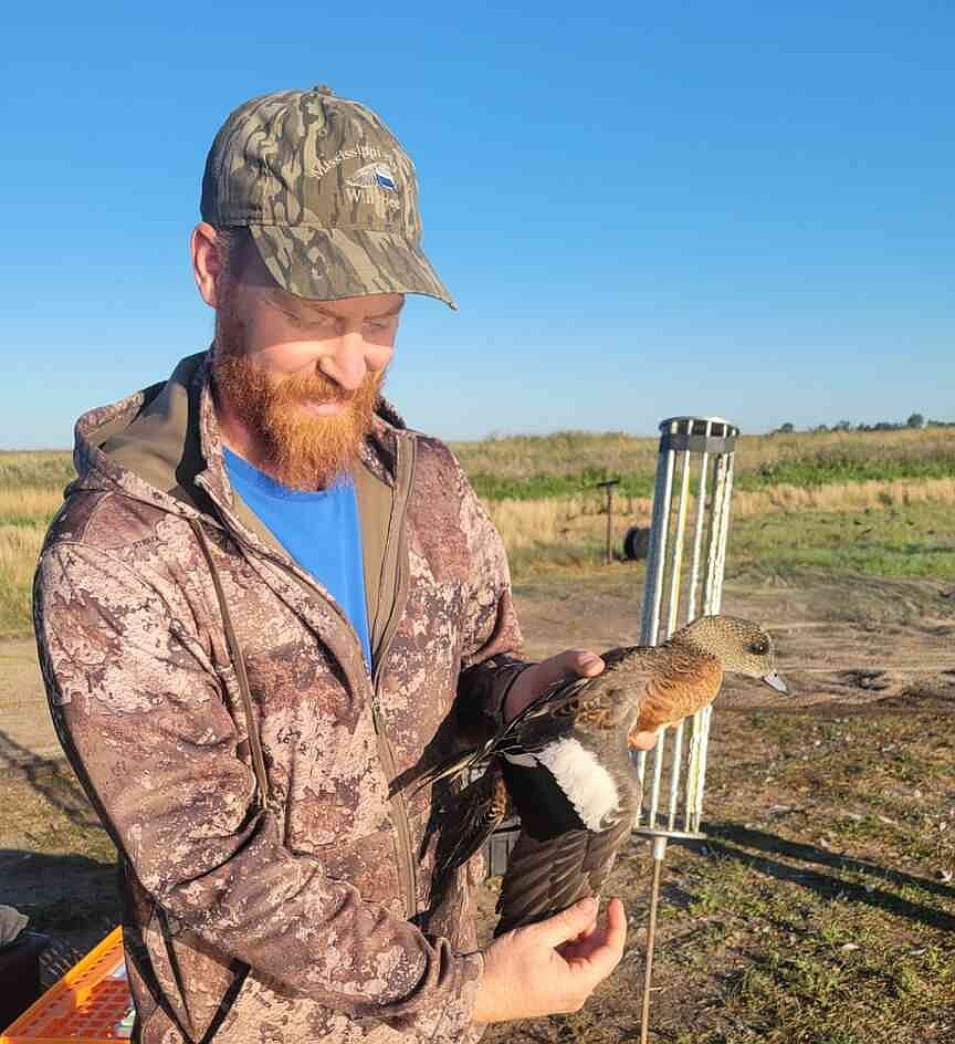 Arkansas Game and Fish Commission crew bands, tracks migrating ducks