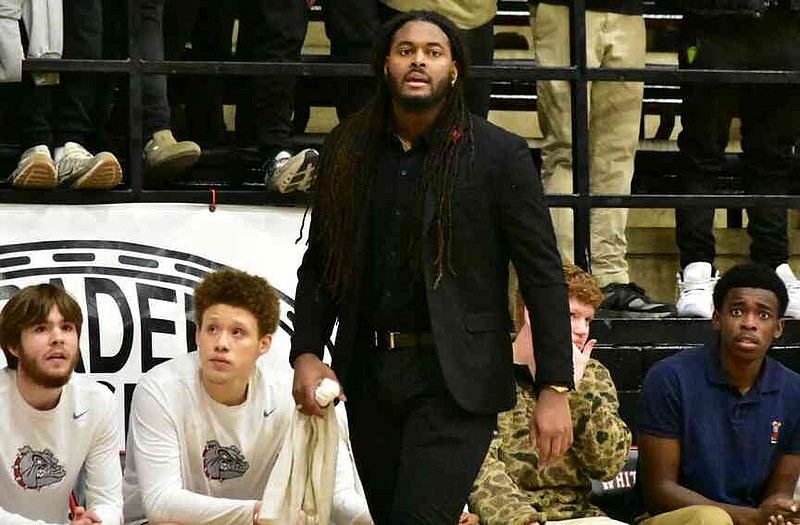 First-year White Hall Coach Trey Lenox instructs his team during the first quarter of the Bulldogs' home opener against El Dorado on Tuesday, Dec. 9, 2025, at Bert Honey Gymnasium in White Hall. (Pine Bluff Commercial/I.C. Murrell)