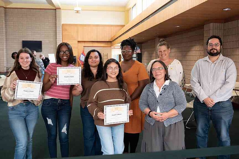 The People's Choice award winners Autumn Smith, left, Nikeonina Allen, Maira Mondragon and Krystal Ramirez, pose with the faculty judges Shuneize Slater, left, Sarah Bloom, Carol Strong and Arturo Quintero Ferrer. Participants were among presenters at the Student Research Symposium at the University of Arkansas at Monticello. (Special to The Commercial/University of Arkansas at Monticello)