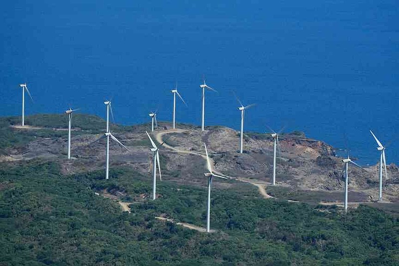 FILE -Windmills are seen at Ilocos Norte province, northern Philippines on May 6, 2024. (AP Photo/Aaron Favila, File)