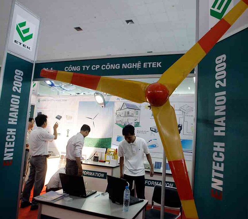 FILE -A wind turbine is seen at the booth of ETEK Technology Joint Stock company during Entech Hanoi 2009, an international trade fair on energy efficiency and the environment, at the Giang Vo Exhibition Center in Hanoi, Vietnam, June 18, 2009. (AP Photo/Chitose Suzuki, File)