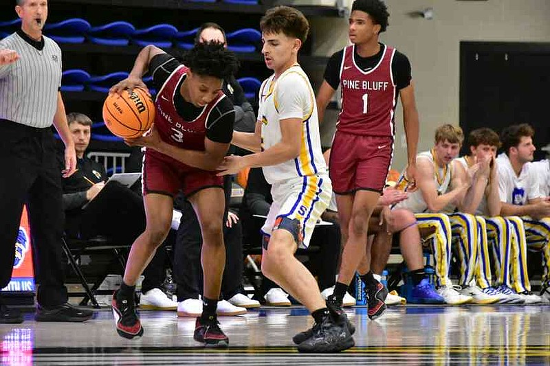 Malik Terry (3) of Pine Bluff is pressured man-to-man by Jace Gatlin of Sheridan as Braylon Turner (1) of Pine Bluff looks on in the second quarter Tuesday, Dec. 16, 2025, at Yellowjacket Arena in Sheridan. (Pine Bluff Commercial/I.C. Murrell)
