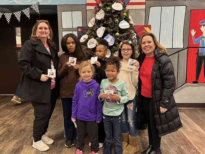 Gandy Elementary School What Christmas Means to Me winners pose with organizers. Front from left: Thatcher Anne Johnson, kindergarten; Indigo Davis, first grade; back: Barbara Summers, Avianna Pherson, fourth grade; Elise Thompson, second grade; Scarlett Rushing, third grade; and Debbie Johnson. (Special to The Commercial)