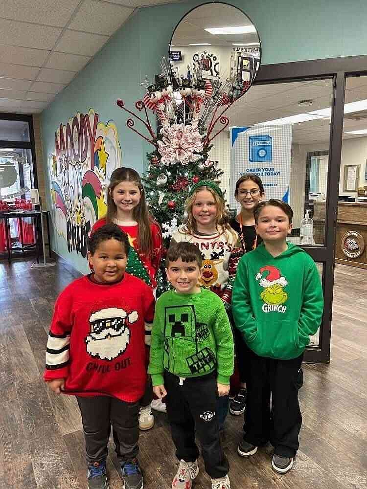 Moody Elementary School What Christmas Means to Me winners pose for a photo. Top from left: Ella Johnson, fourth grade; Elizabeth Rittenhouse, third grade; Shelby Huber, fifth grade; and front from left: Louie Barajas, kindergarten; Luke Downey, first grade; and Logan Cooper, second grade. (Special to The Commercial)
