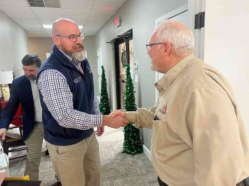 John Anderson, left, Arkansas Cooperative Extension Service director, congratulates Bradley County Ag Extension Agent John Gavin on 42 years of service to the University of Arkansas System Division of Agriculture on Dec. 17. (Special to The Commercial/University of Arkansas System Division of Agriculture)
