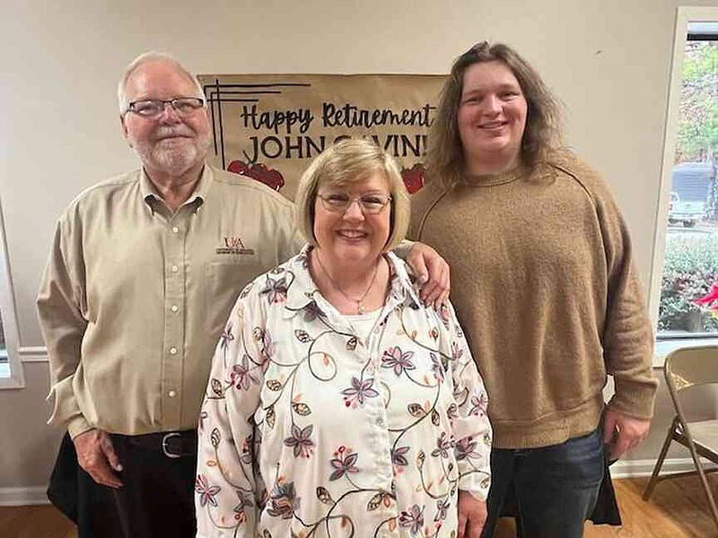 Bradley County Ag Extension Agent John Gavin, with his wife, Sandy, and son, Weston, was celebrated for his 42 years with the Cooperative Extension Service during a retirement party Dec. 17 at the Warren County Club. (Special to The Commercial/University of Arkansas System Division of Agriculture)