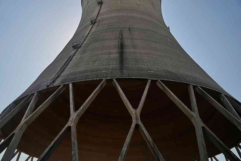 FILE - The base of a cooling tower at Constellation's nuclear power plant stands on Three Mile Island near Middletown, Pa., June 25, 2025. (AP Photo/Stephanie Scarbrough, File)