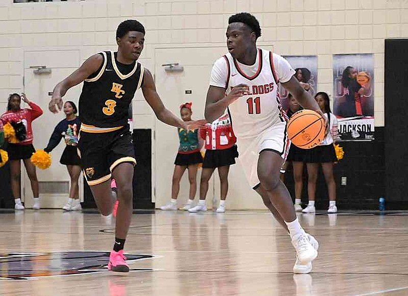 Korey Hope (11) of White Hall pushes the ball in the transition against Braelyn Hughes (3) of Watson Chapel in the second quarter Tuesday, Dec. 22, 2025, at Bert Honey Gymnasium in White Hall. (Pine Bluff Commercial/I.C. Murrell)