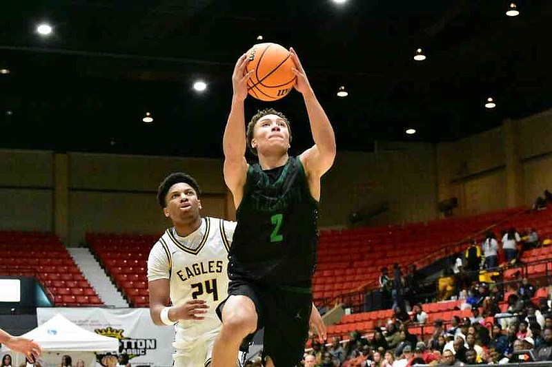 Malcolm Price of St. Joseph (Santa Maria, Calif.) drives to the basket against Josiah Rose of Faith Family Academy (Dallas) in the first quarter of a King Cotton Holiday Classic game Monday, Dec. 29, 2025, at the Pine Bluff Convention Center. (Pine Bluff Commercial/I.C. Murrell)