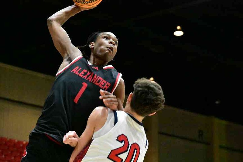Cam Jackson of Alexander (Douglasville, Ga.) draws a foul in a dunk attempt against Carson Countryman of Atascocita, Texas, in the fourth quarter of a King Cotton Holiday Classic game Tuesday, Dec. 30, 2025, at the Pine Bluff Convention Center. (Pine Bluff Commercial/I.C. Murrell)