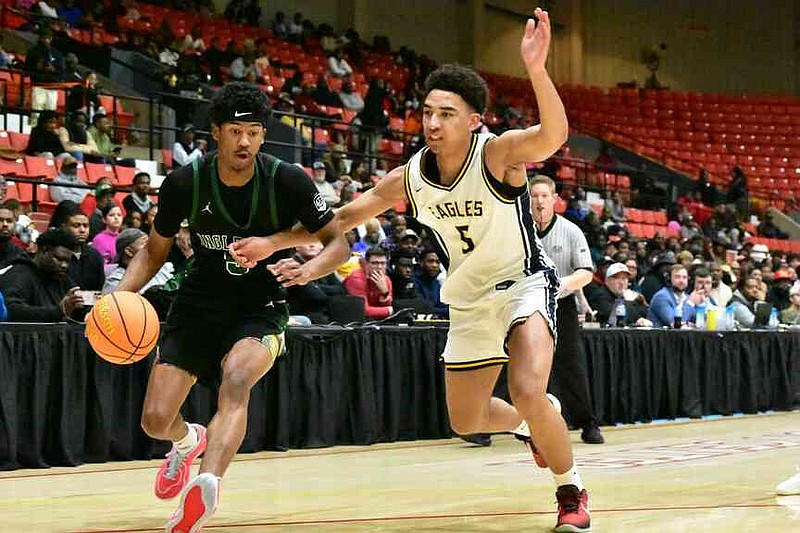Jason Crowe Jr. of Inglewood, Calif., handles the ball against Tayshaun Williams of Faith Family Academy (Dallas) in the first quarter of the King Cotton Holiday Classic championship game Tuesday, Dec. 30, 2025, at the Pine Bluff Convention Center. (Pine Bluff Commercial/I.C. Murrell)