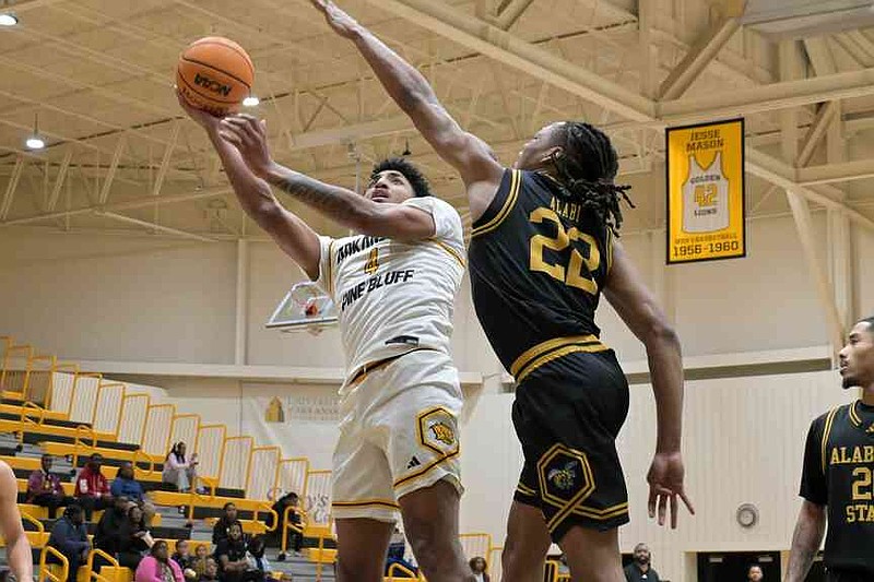 Jaquan Scott of UAPB hooks a shot over Kevin Alabi of Alabama State in the first half Monday, Jan. 5, 2026, at H.O. Clemmons Arena. (Pine Bluff Commercial/I.C. Murrell)