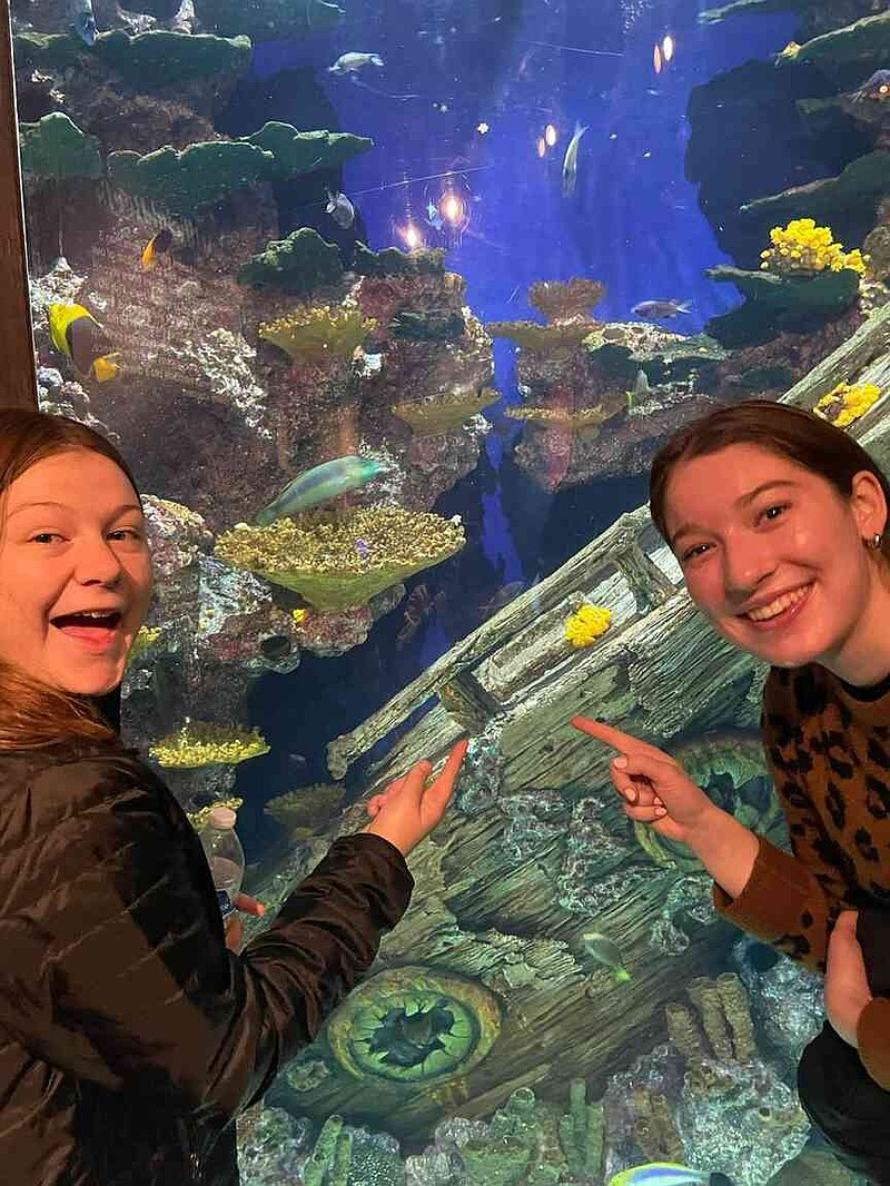 Madison County 4-H member Vallie Yancey (left) and Montgomery County 4-Her Opal Samons visit the Georgia Aquarium while attending National 4-H Congress in Atlanta, Ga., Nov. 28-Dec. 2, 2025. Both teens are part of the Arkansas 4-H State Officer team. (Special to The Commercial/University of Arkansas System Division of Agriculture)