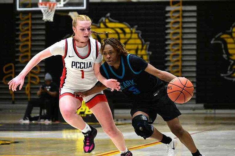 Takiela Jones of Southeast Arkansas College handles the ball as Mariah Koss of Phillips Community College of the University of Arkansas closely defends in the second half Wednesday, Jan. 7, 2026, at H.O. Clemmons Arena. (Pine Bluff Commercial/I.C. Murrell)