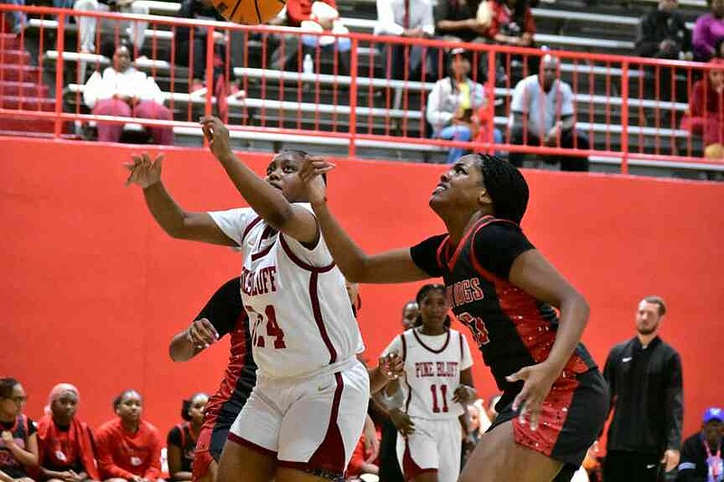 Kaliah Parks of Pine Bluff and Blair Weston of White Hall battle for a loose rebound in the second half Friday, Jan. 9, 2026, at Pine Bluff's Jack Robey campus. (Pine Bluff Commercial/I.C. Murrell)