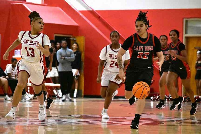 Kynnedi Barnett of White Hall pushes the ball in transition as Cydney Shepherd of Pine Bluff tracks her down in the second half Friday, Jan. 9, 2026, at Pine Bluff's Jack Robey campus. (Pine Bluff Commercial/I.C. Murrell)