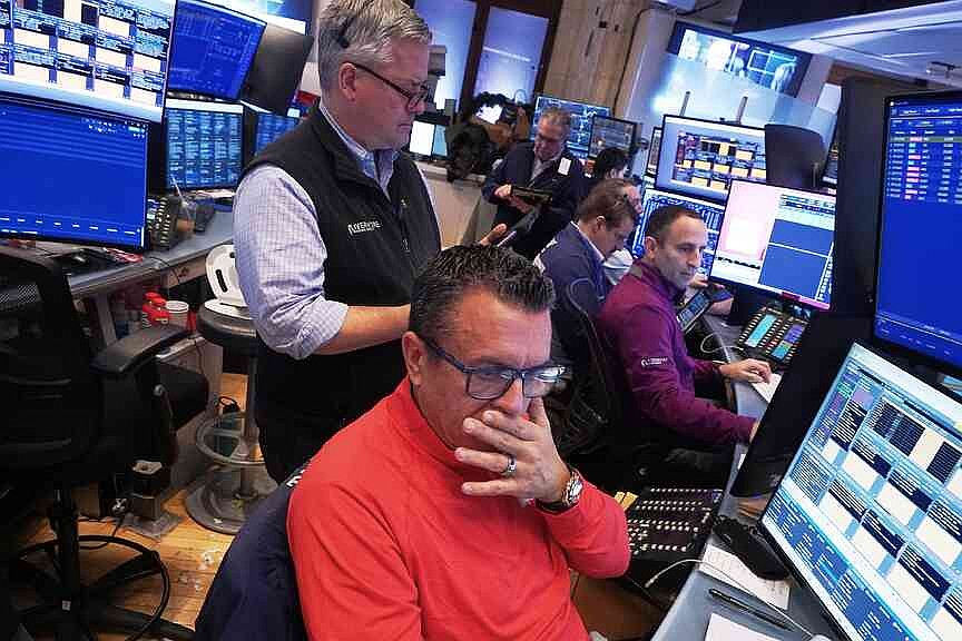 Wall Street falls from records after mixed reports