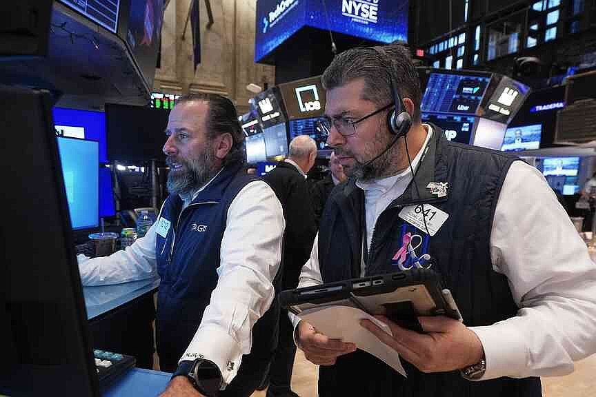 Stocks slip slightly to close week of earnings reports