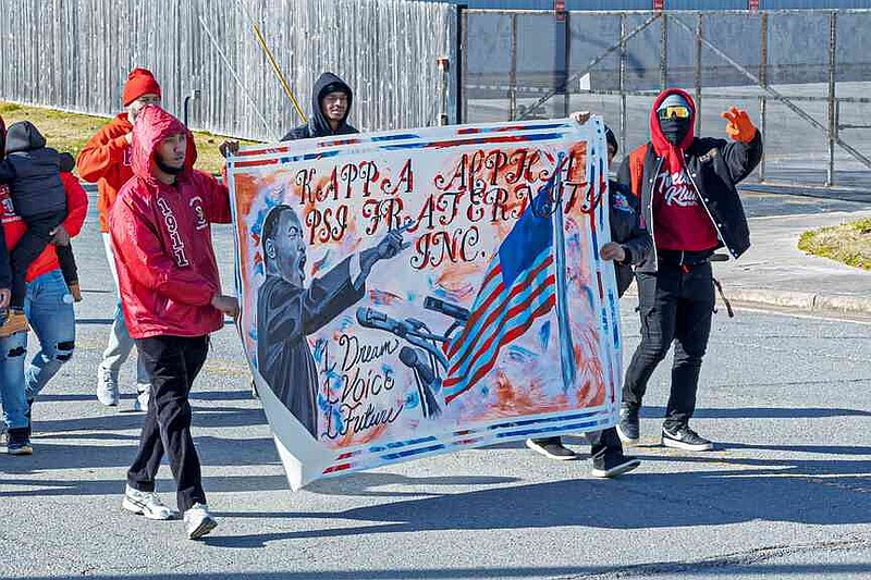 Kappa Alpha Psi Fraternity Inc. marches down Third Avenue during the Original KingFest Marade. (Pine Bluff Commercial/Eplunus Colvin)