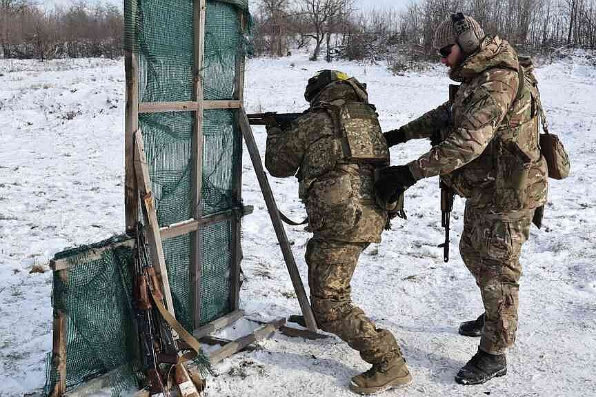 Ukraine endures bitter cold as US talks near