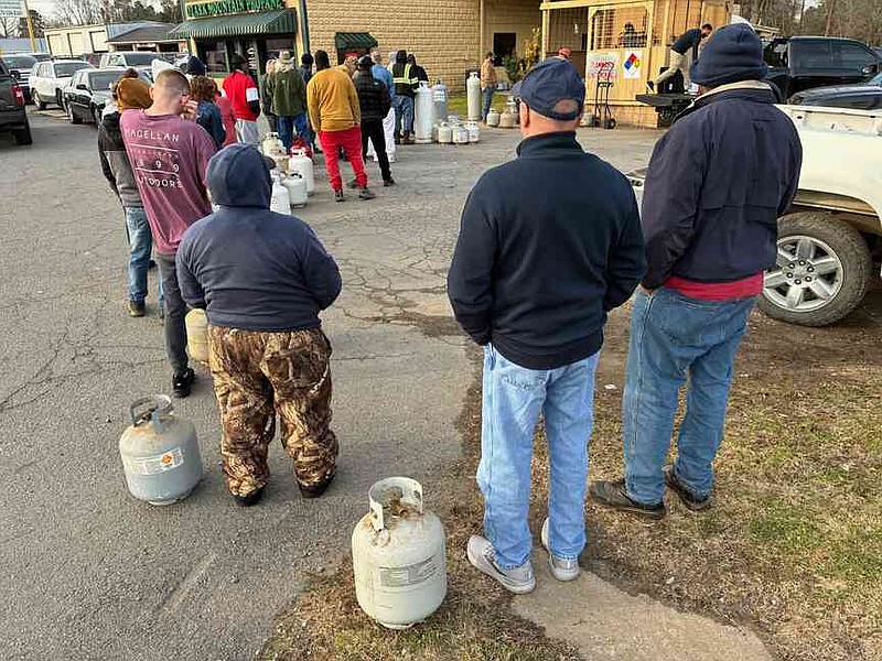 Customers queue up at Ozark Mountain Propane on Dollarway Road on Thursday afternoon to get their tanks filled ahead of this weekend's winter storm. Asked if the business had been swamped all day, a person in the front office said 'We've been slammed all week.' (Pine Bluff Commercial/Byron Tate)