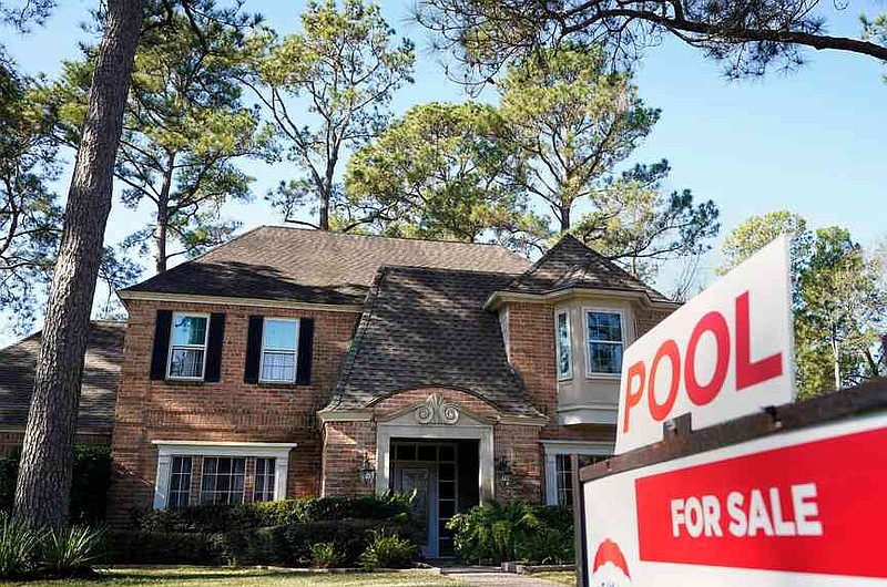 FILE - A real estate sign is shown at a home for sale in Houston, Jan. 13, 2021. (Melissa Phillip/Houston Chronicle via AP, File)