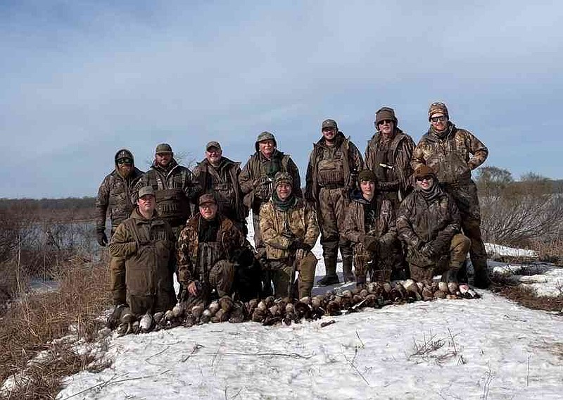 Hunters 957 -- Fourteen hunters found an open hole of water during the deep freeze where they experienced a