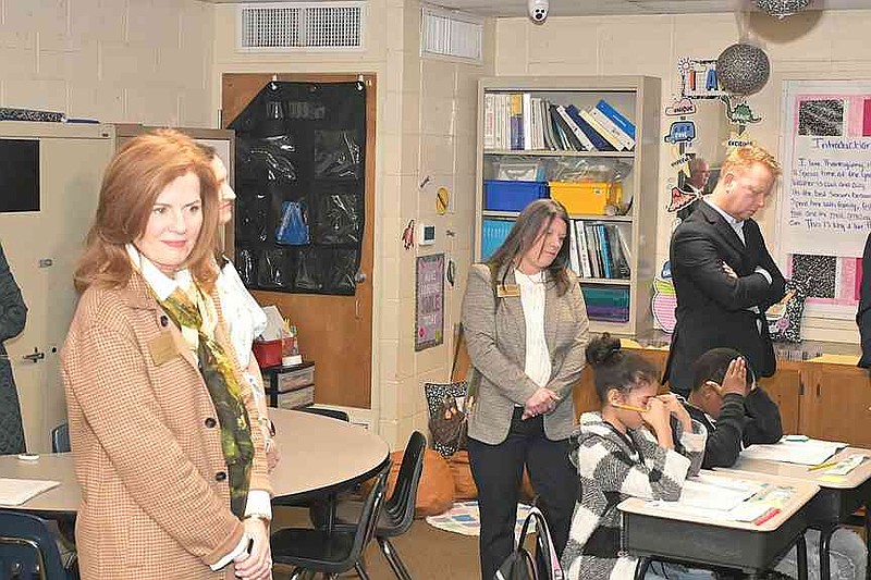 State Education Board vice chair Lisa Hunter of White Hall (left), state Teacher of the Year Jeanie Wilcoxon and State Board member Jeff Wood oversee students learning in a third-grade classroom at Coleman Elementary in the Watson Chapel School District on Thursday, Feb. 12, 2026. (Pine Bluff Commercial/I.C. Murrell)