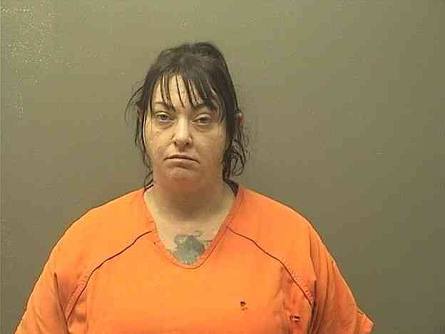 Woman arrested on drug charges after allegedly found asleep in running car