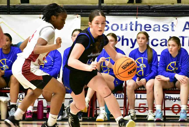 Ainsley Stevens of Sheridan drives to the basket past Kenleigh Caldwell of White Hall in the second half Tuesday, Feb. 17, 2026, at Bert Honey Gymnasium in White Hall. (Pine Bluff Commercial/I.C. Murrell)
