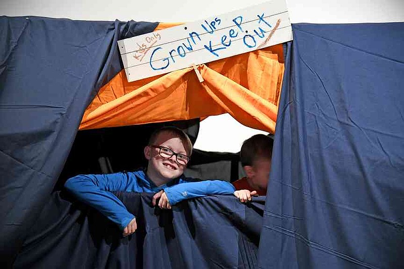 Children play in a blanket fort that was part of The Family Room exhibit at Mid-America Science Museum on March 2, 2024. The exhibit, which was designed and built by museum staff, is returning and will run from March 1 through March 31. (The Sentinel-Record/File)