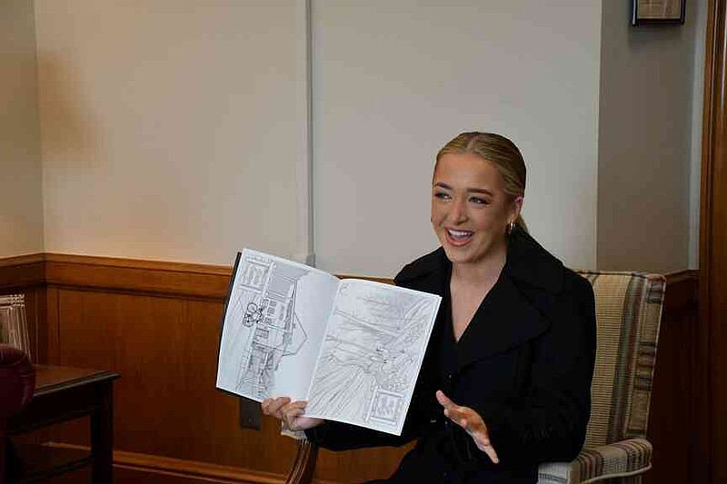 Presley Bennett displays the coloring book, 'Peaceful Places,' she was inspired to create to accompany a calming room at a middle school. (Special to The Commercial)