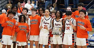 Subiaco Trojans pose with the trophy on Saturday, Feb. 28, 2026, after winning the Class 3A Region 1 Tournament in Paris. Visit rivervalleydemocratgazette.com/rvphotos for today's photo gallery. (Special to the River Valley Democrat-Gazette/Ron Green)