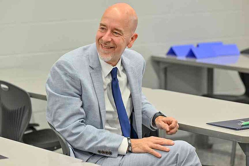 Arkansas Department of Education Secretary Jacob Oliva smiles Wednesday during a classroom tour at Oakdale Middle School in Rogers. Oliva, Ken Warden, commissioner of the Arkansas Division of Higher Education, and Joel Rose, co-founder and chief executive officer of New Classrooms, visited Oakdale Elementary to view the implementation of New Classrooms program Teach to One Roadmaps, a digital math teaching tool that allows students to work through math concepts at their own pace. Visit nwaonline.com/photo for today's photo gallery.  (NWA Democrat-Gazette/Caleb Grieger)