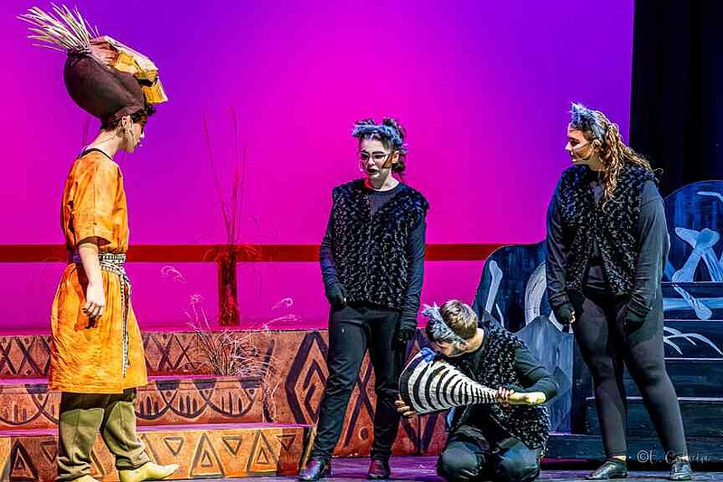 Shenzi, Banzai, and Ed plot their next move with Scar in the Elephant Graveyard. (Pine Bluff Commercial/Eplunus Colvin)