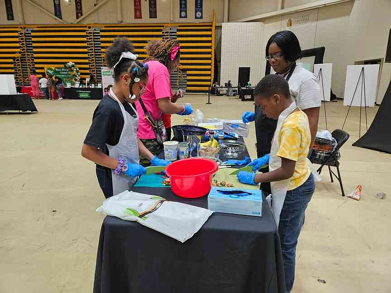 Young participants get hands-on with healthy food prep during an interactive cooking demonstration at the Black Family Wellness Expo on Saturday, March 21, 2026, learning practical skills for better nutrition. (Special to the Commercial)
