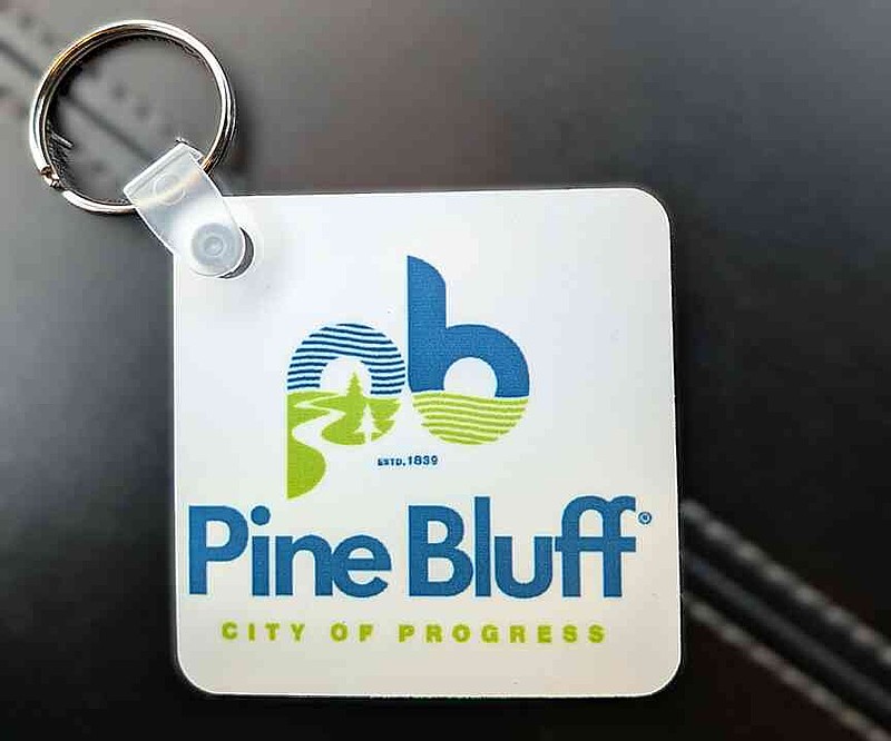The new logo for Pine Bluff is printed on keychains handed out following Mayor Vivian Flowers' State of the City address Monday, March 30, 2026. (Pine Bluff Commercial/I.C. Murrell)