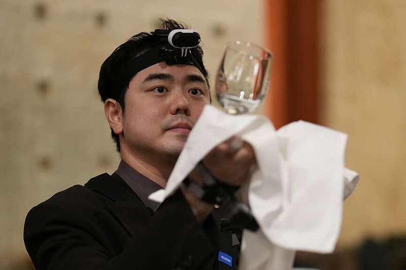David Park, food and beverage manager at Lotte Hotel Seoul, demonstrates during an interview with The Associated Press on Tuesday, April 28, 2026 in Seoul, South Korea.