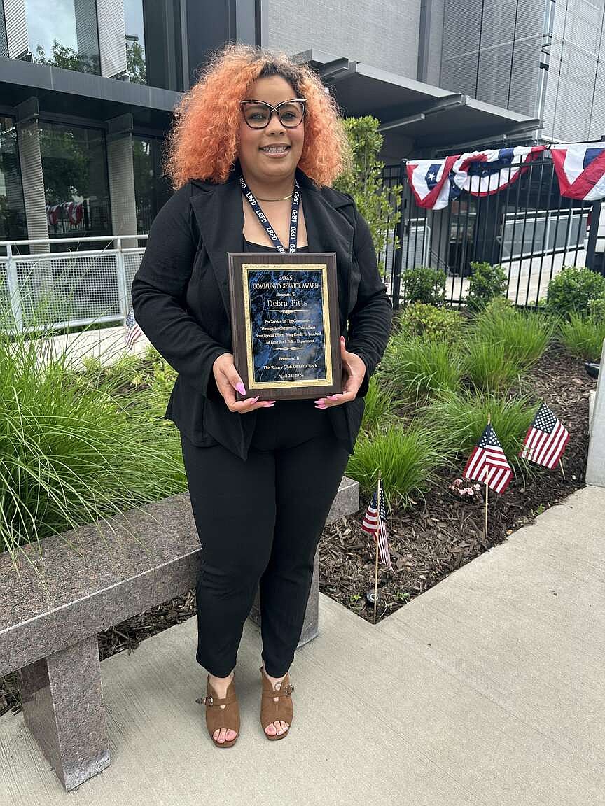 Debra Pitts, an employee of the Little Rock Police Department, awarded for aid first sparked by fires