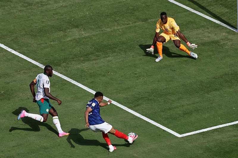 France's Kylian Mbappe scores their opening goal during the World Cup Group I soccer match between France and Senegal in East Rutherford, N.J., near New York, Tuesday, June 16, 2026. (AP Photo/Adam Hunger)