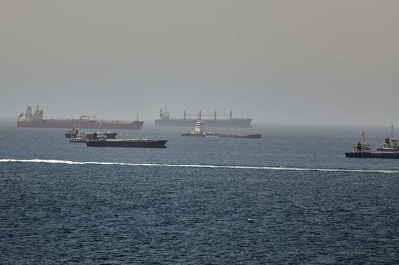 Tankers and cargo vessels are seen in the Gulf of Oman, along shipping routes linking the Strait of Hormuz and the Arabian Sea, Tuesday, June 16, 2026. (AP Photo)