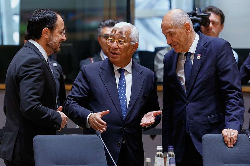 From left, Cypriot President Nikos Christodoulides, European Council President Antonio Costa and Slovenia's Prime Minister Janez Jansa talk during a round table meeting at the EU summit in Brussels, Friday, June 19, 2026. (AP Photo/Geert Vanden Wijngaert)